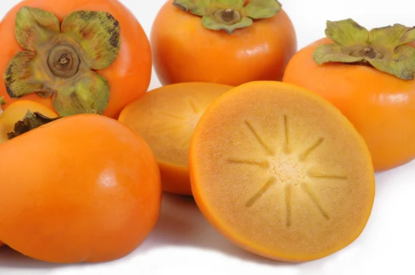 Fruta fresca de caqui sobre fondo — Foto de Stock