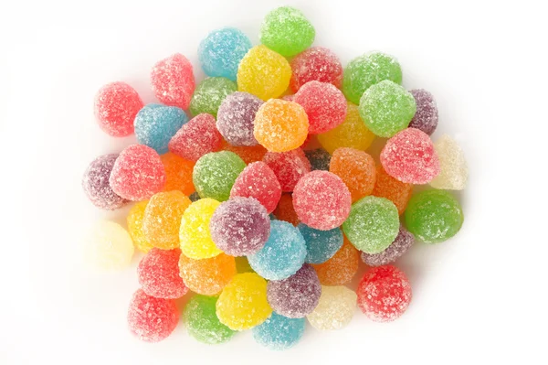 Beaucoup de bonbons gommeux colorés sur fond blanc — Photo