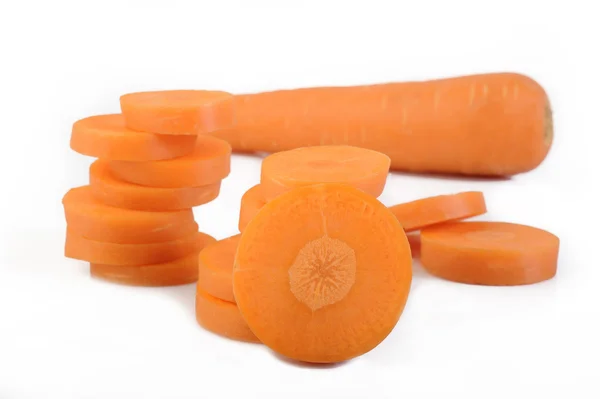 Fresh sliced carrots on white background — Stock Photo, Image