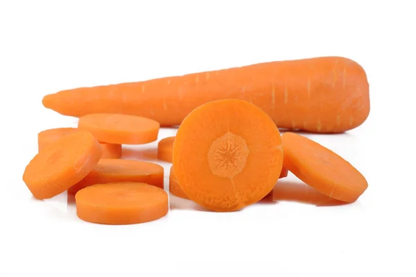 Fresh sliced carrots on white — Stock Photo, Image