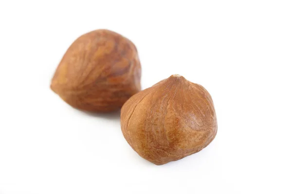 Peeled hazelnuts isolated on white background — Stock Photo, Image