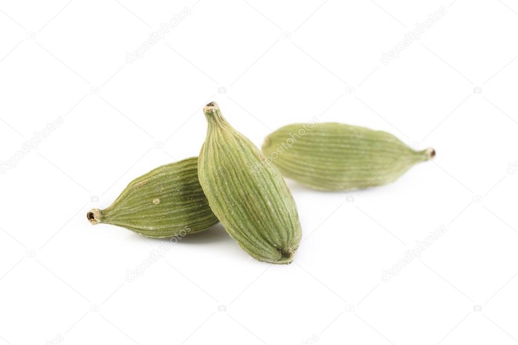 green cardamom pods isolated on white background