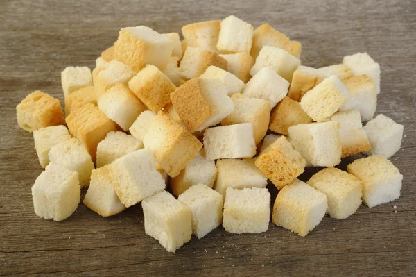 Bread cube on wooden — Stock Photo, Image