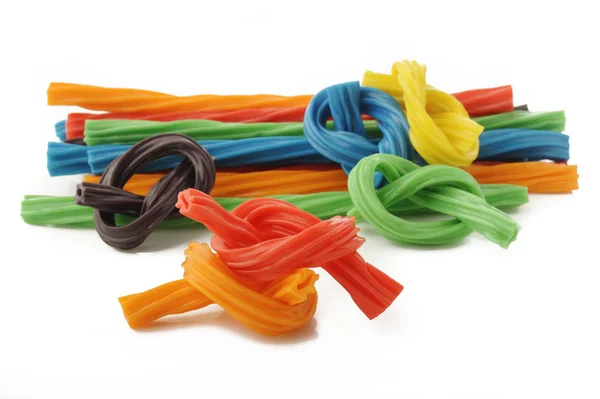 Colorful licorice candy shaped like a twisted rope on white backgroun — Stock Photo, Image