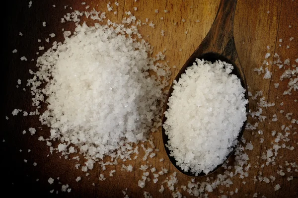 Salt in wooden spoon — Stock Photo, Image