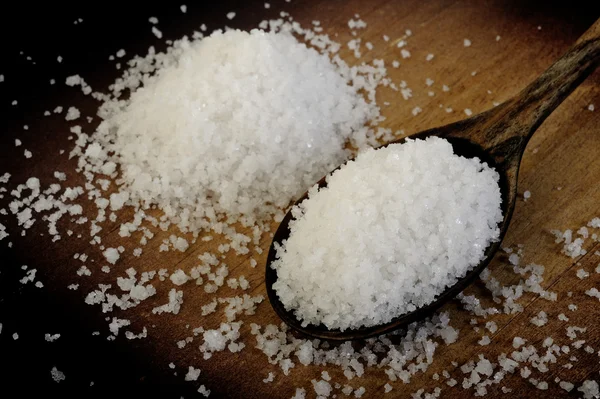 Salt in wooden spoon — Stock Photo, Image