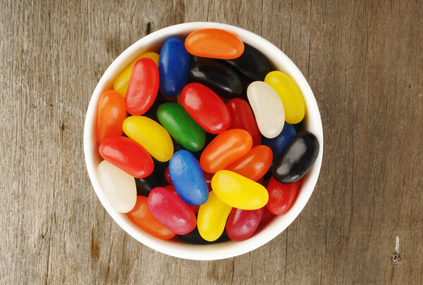 Jelly Beans in a bowl on wooden 