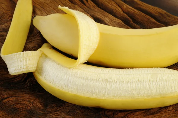 Fresh bananas on wooden background — Stock Photo, Image