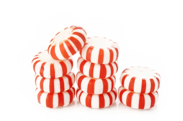 Red striped peppermints on a white background — Stock Photo, Image