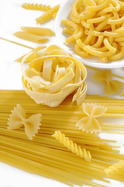 Raw pasta on white background — Stock Photo, Image