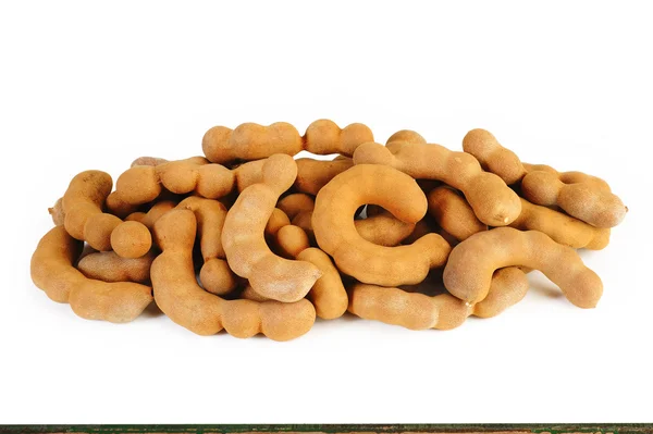 Ripe tamarind fruit on white — Stock Photo, Image