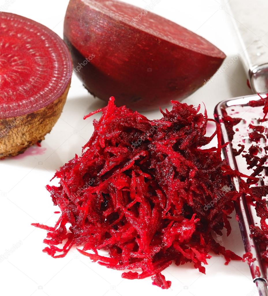 grated beets on a white 