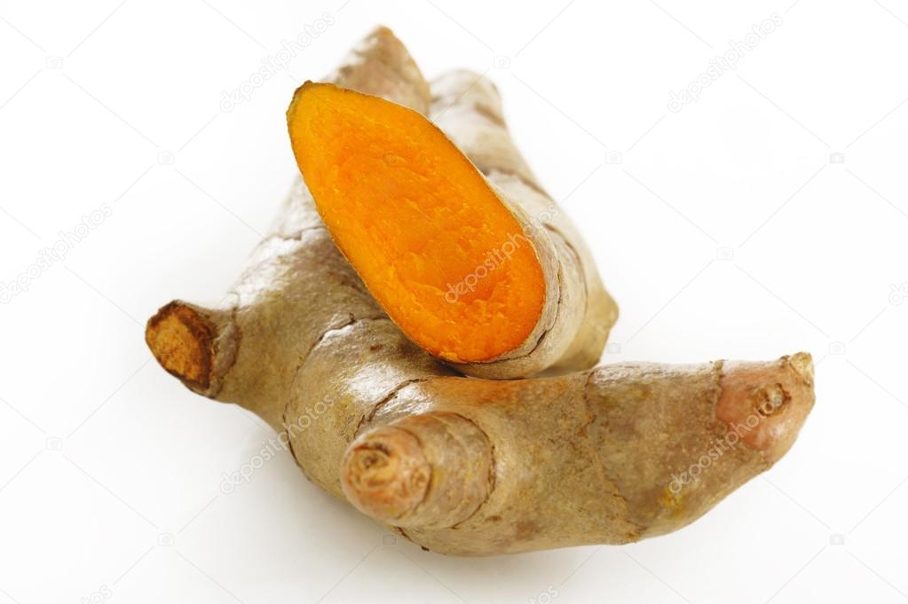 Turmeric root on white background