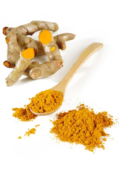 Turmeric powder in wooden spoon — Stock Photo, Image