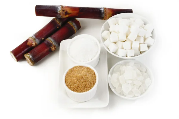 Various kinds of sugar on white — Stock Photo, Image