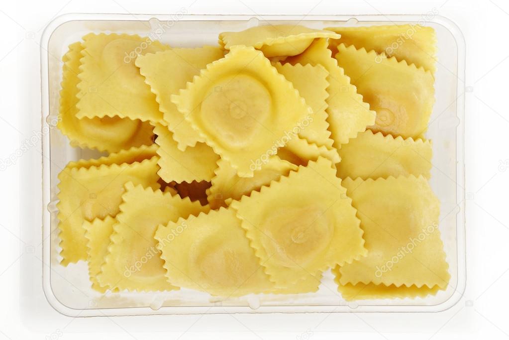 Dry ravioli pasta in plastic box