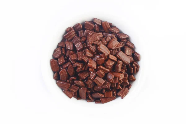 Choklad flake på vit — Stockfoto