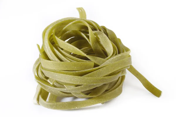 Spinach fettuccine pasta on white background — Stock Photo, Image