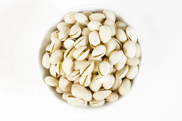 Pistachos en una taza — Foto de Stock