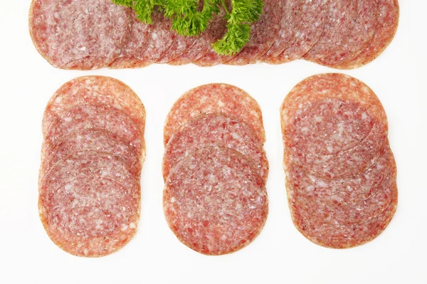 Torkad salami på vit — Stockfoto