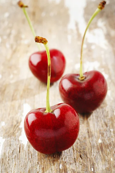 Cherry on wood — Stock Photo, Image