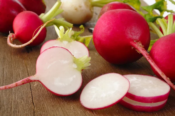 Radishes on wooden table — Stock Photo, Image