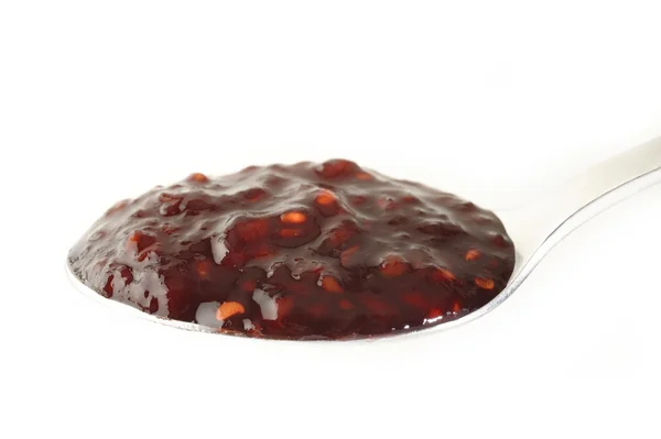 Malinový džem v lžíce — Stock fotografie