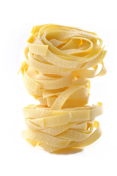 Egg fettuccine pasta on white background — Stock Photo, Image
