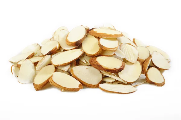 Sliced raw almonds on white background — Stock Photo, Image