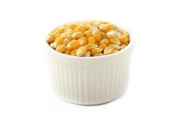 Sementes de milho na tigela branca — Fotografia de Stock