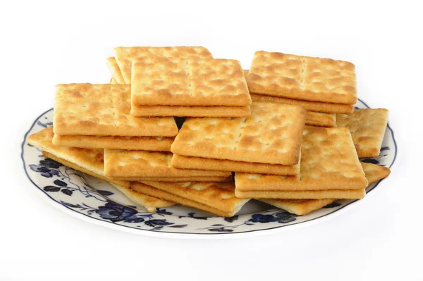 Galletas saladas en un plato — Foto de Stock