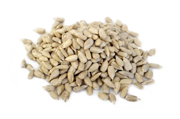 Peeled sunflower seeds on white background — Stock Photo, Image