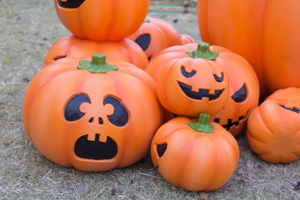 Halloween scary pumpkin with a smile in autumn park