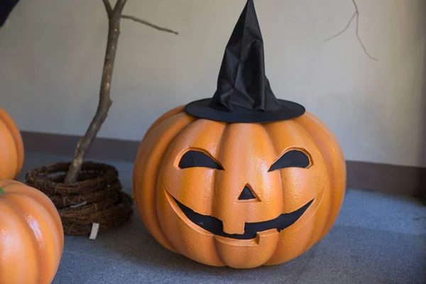 Halloween scary pumpkin with a smile in autumn park