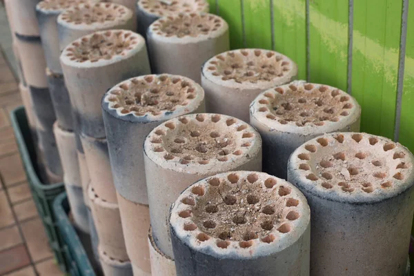 Coal briquet cylindrical solid fuel mixed. briquettes are piled up