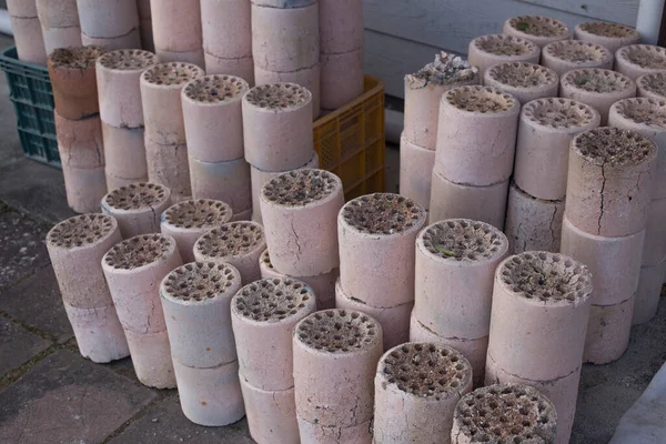 Coal briquet cylindrical solid fuel mixed. briquettes are piled up