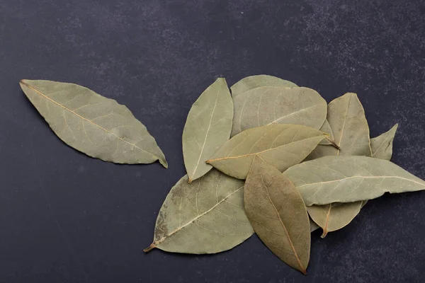 Dry Bay leaves isolated on black background
