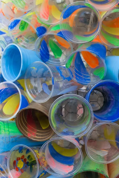 Colored plastic cups. The concept of plastic recycling and the environment. Plastic waste