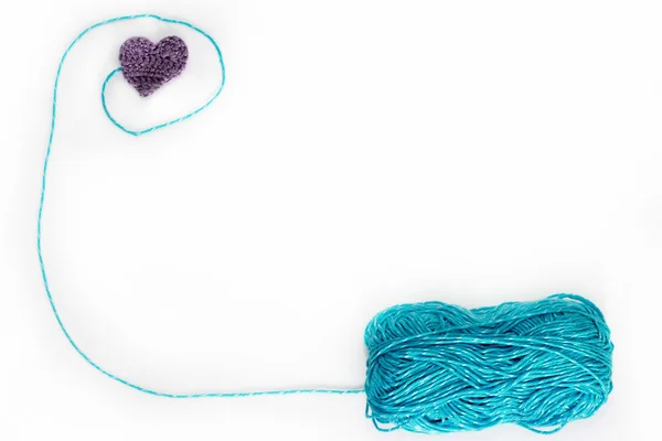 Blue skein with crochet heart — Stock Photo, Image
