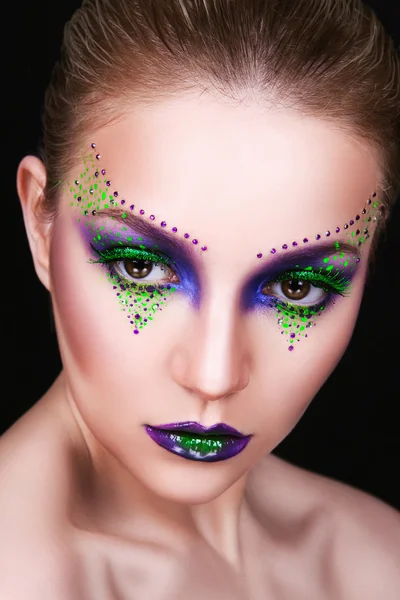 Portrait of a beautiful young girl with professional makeup — Stock Photo, Image