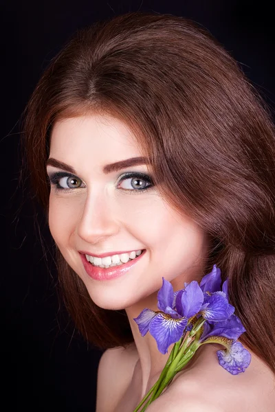 beautiful young girl with a flower in her hair, makeup