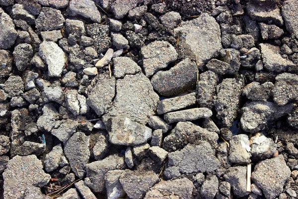 Wreckage of pieces of old broken asphalt — Stock Photo, Image