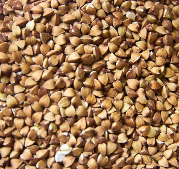 Granos de trigo sarraceno como fondo. comida saludable. comida vegetariana — Foto de Stock