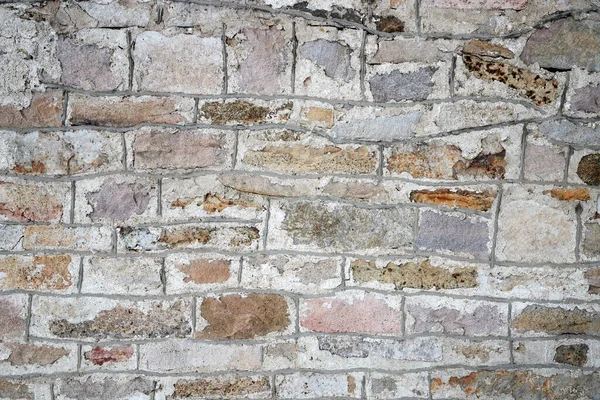 Textuur van een oude stenen muur met metselwerk naden — Stockfoto
