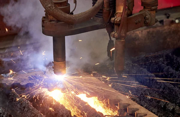 sparks of plasma cutting machine nozzles during cutting metal detail