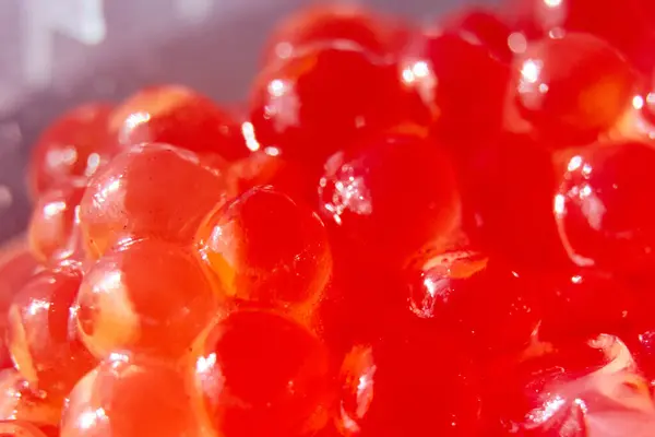 Close-up background of red caviar in a jar — Stock Photo, Image