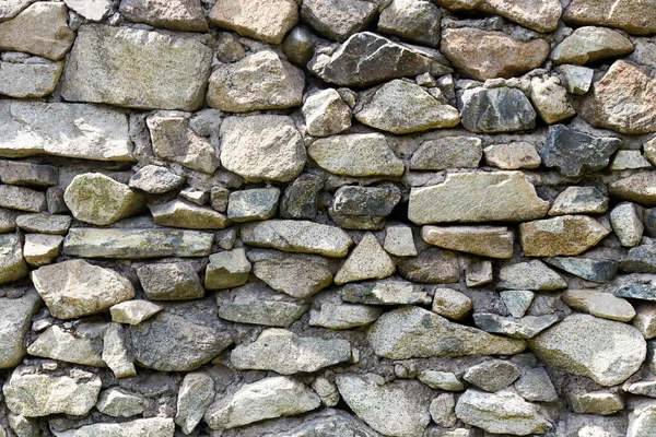 Pared de una antigua casa hecha de piedras —  Fotos de Stock