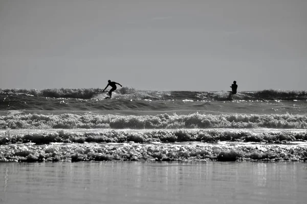 Silhouette Images Surfers Riding Waves Llangennith Beach Gower Peninsula Popular — Stock Photo, Image