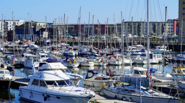 Swansea, Wales, June 10 2021: The vibrant marina and waterfront development in Swansea is a successful regeneration project which has brought prosperity and value to this welsh community. clipart