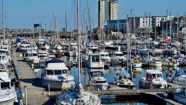 Swansea, Wales, June 10 2021: The vibrant marina and waterfront development in Swansea is a successful regeneration project which has brought prosperity and value to this welsh community.
